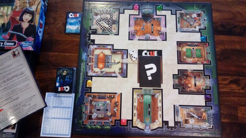 Closeup showing the Clue board game almost set up.