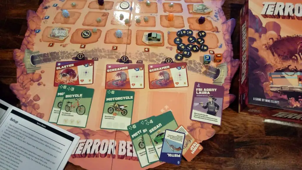 Closeup of part of the Terror Below board and game components.