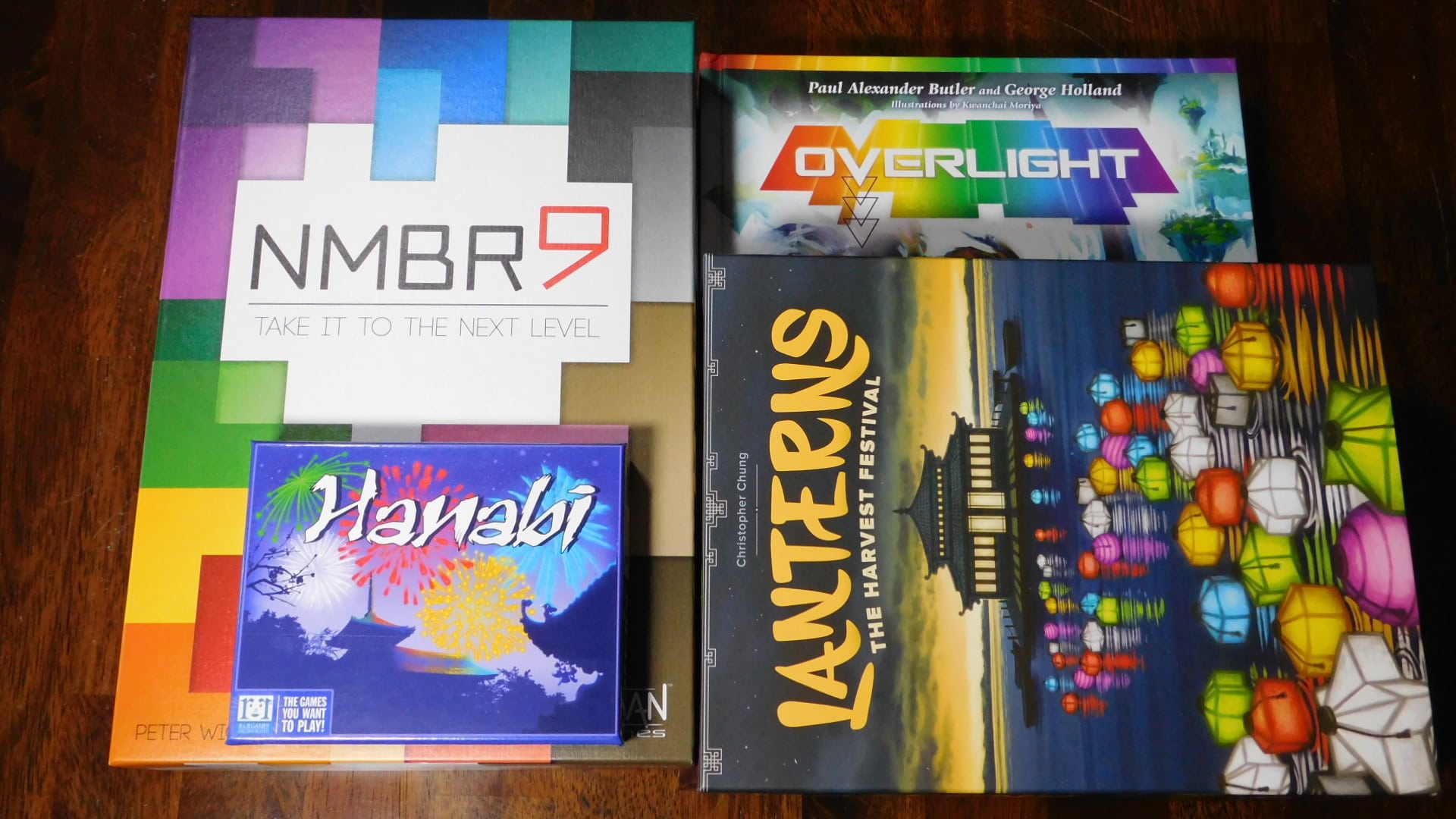 A closeup of various board games that relate to rainbows.