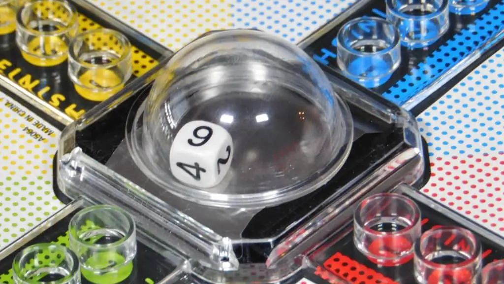 A closeup of the pop-o-matic bubble in the board game, Trouble.