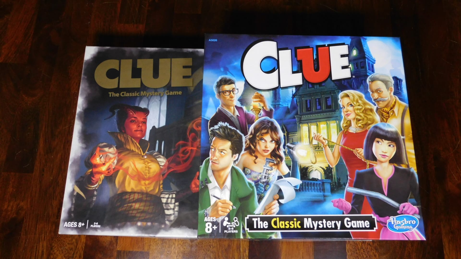 A closeup of two versions of Clue.
