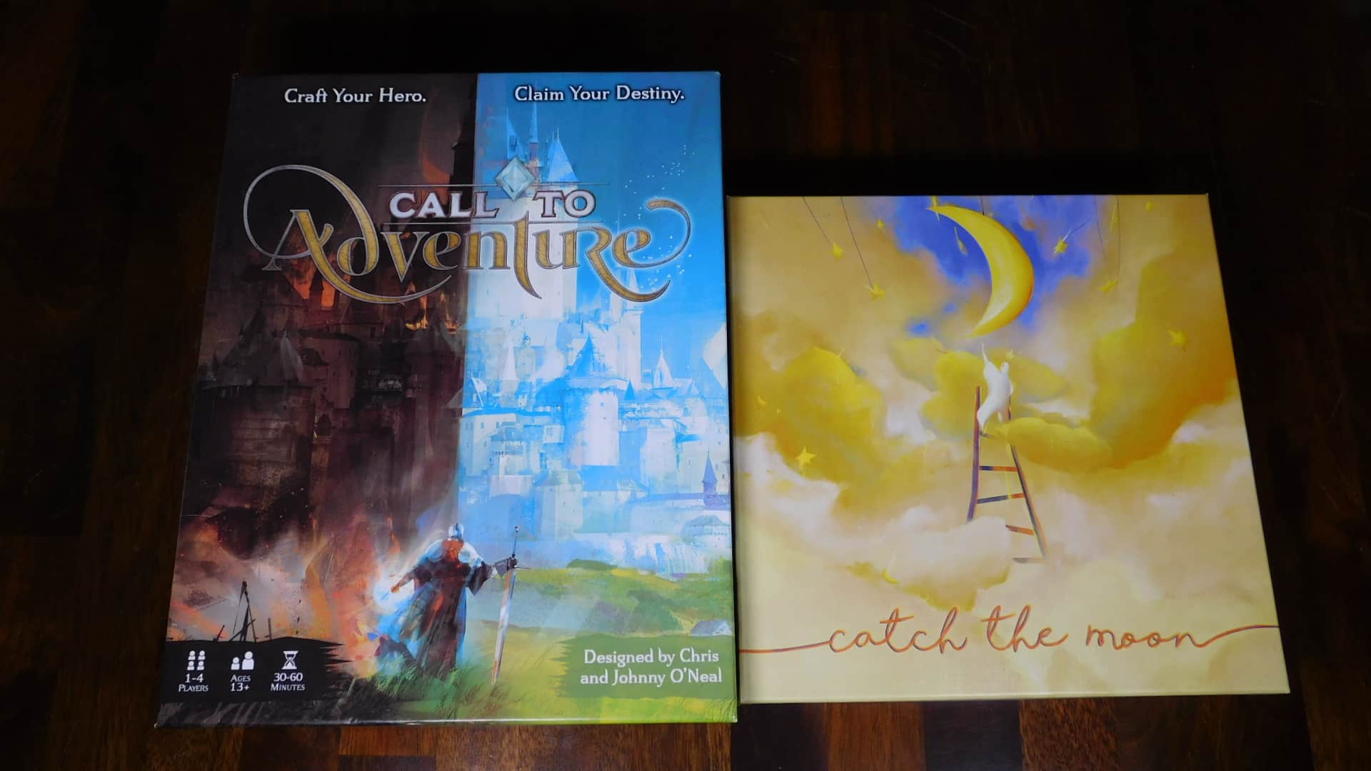 A closeup of the box covers for the games, Call To Adventure and Catch The Moon.