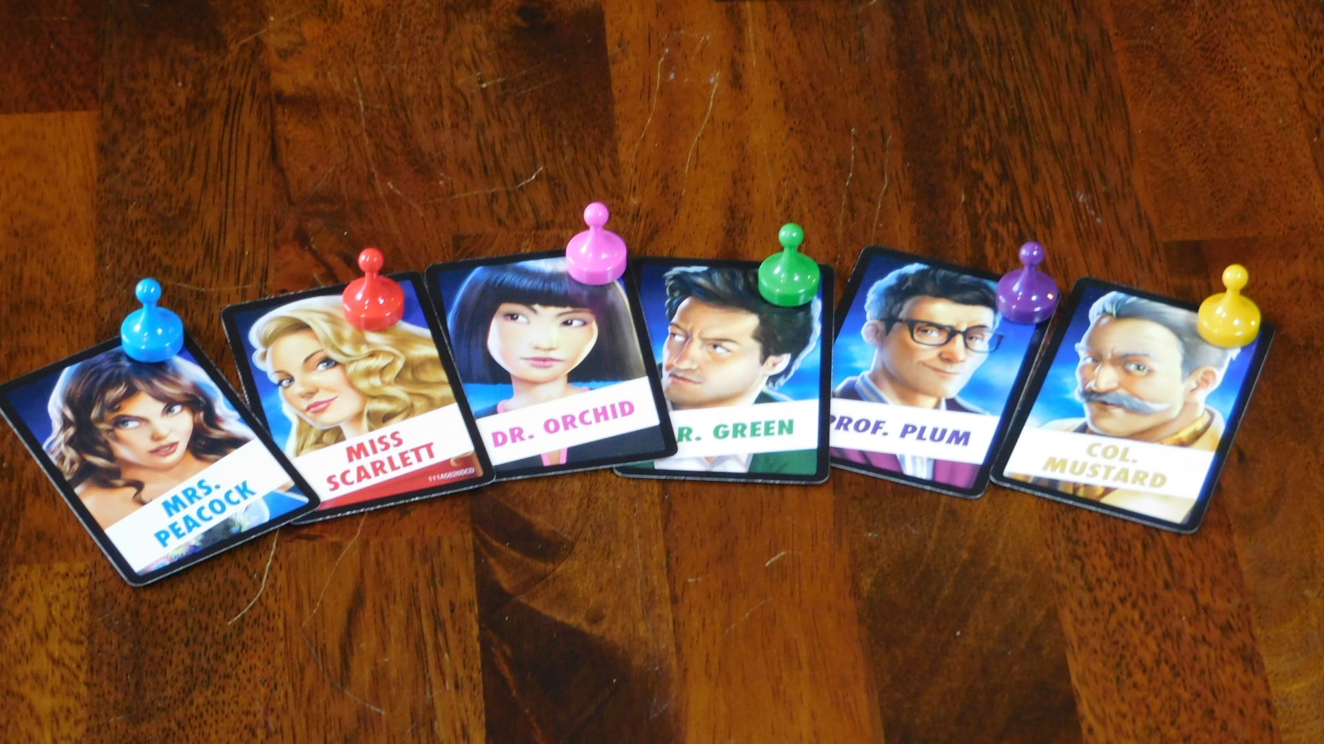 An array of Clue person cards plus the pawns.
