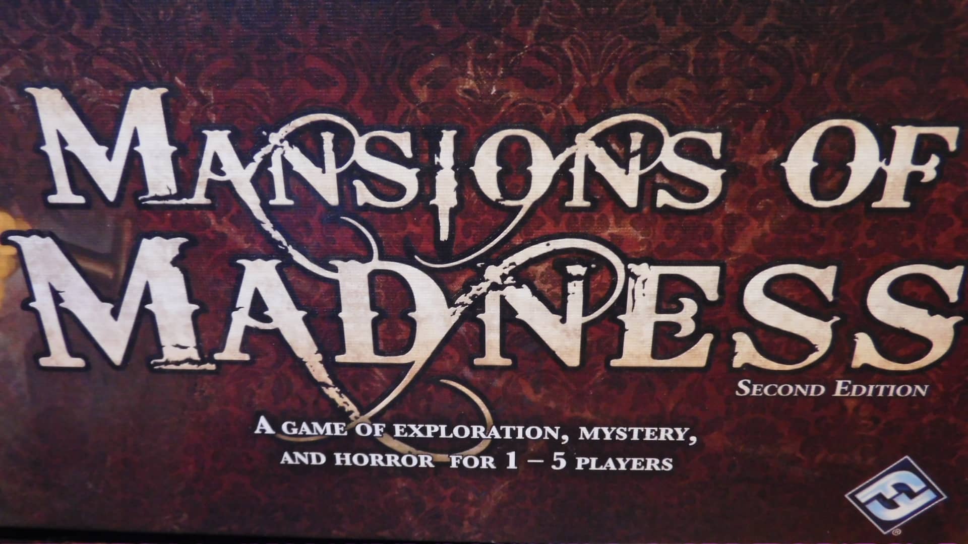 A closeup of the words, "Mansions Of Madness," on the Mansions Of Madness 2nd Edition box cover.