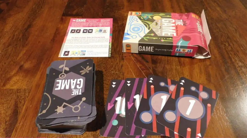 An opened copy of The Game with all components on a table.