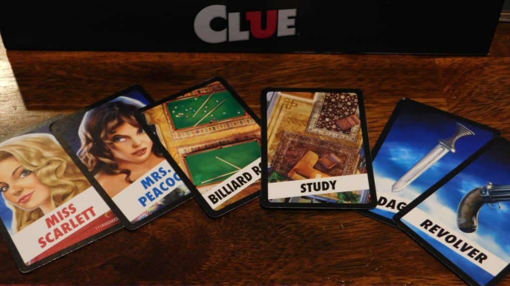 A closeup of the art on some of the cards in Clue (2018).
