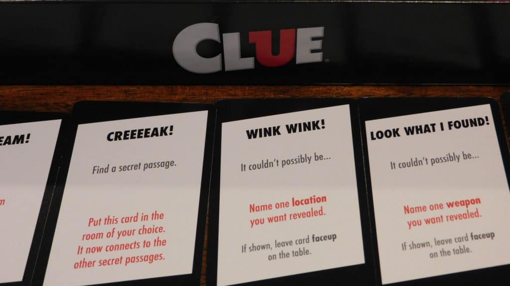 A closeup of the clue cards in Clue (2018).