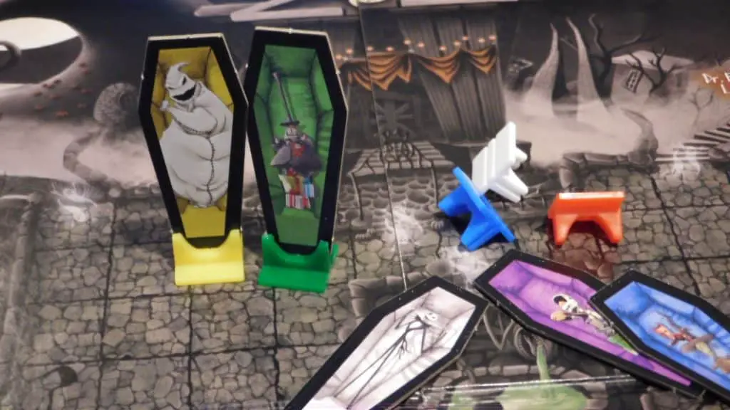 A closeup of some standees standing on the game board for Clue: Tim Burton's The Nightmare Before Christmas.