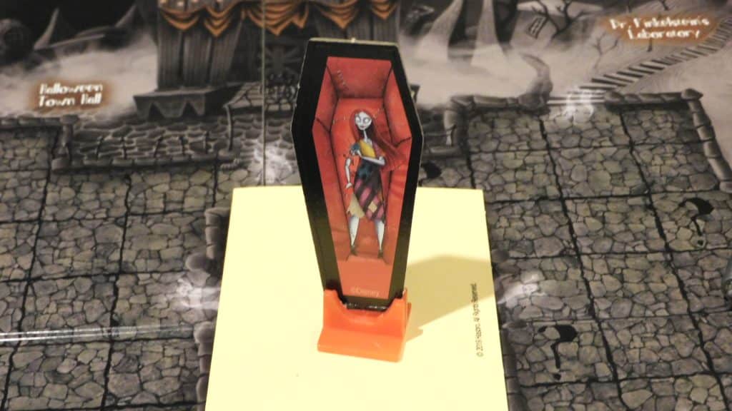 Clue: Tim Burton's Nightmare Before Christmas closeup showing the Sally standee standing on the answers envelope on the game board.