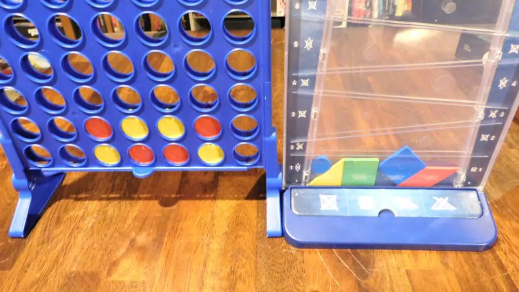 A game of Connect 4 in progress next to a game of Drop It in progress.