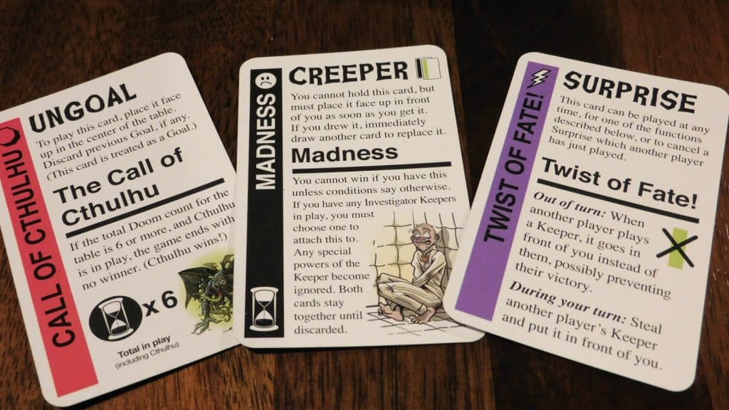 An Ungoal, Creeper, and Surprise card from Cthulhu Fluxx.
