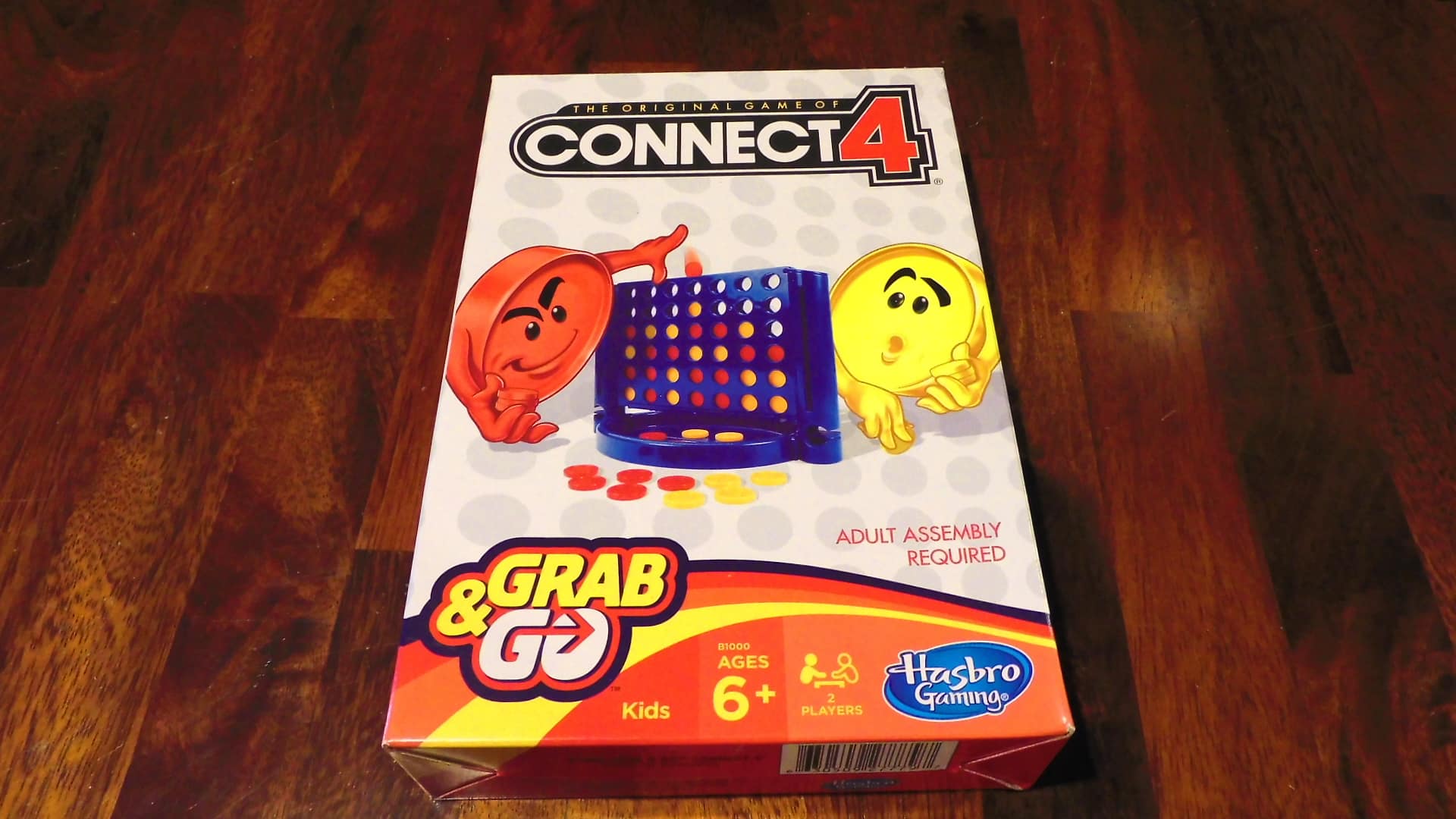 A closeup of the box cover for Connect 4 Grab & Go.