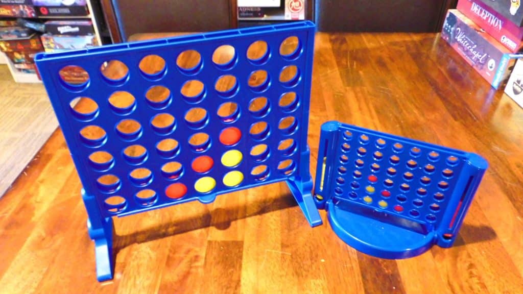 Connect 4 and Connect 4 Grab & Go side by side on a table.