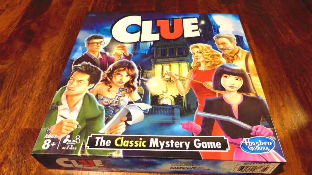 A closeup of the box for Clue, which is sitting on a table.