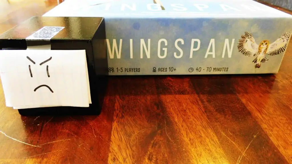A closeup of Alpha Gamer Al and one side of the Wingspan box.