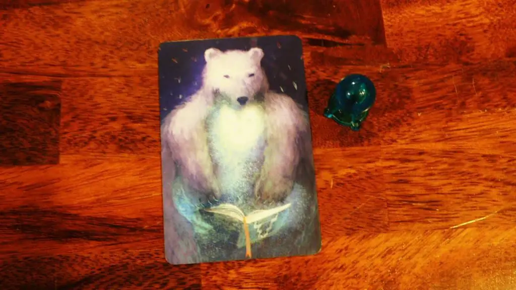 A Vision Card next to an Intuition Token in Mysterium.