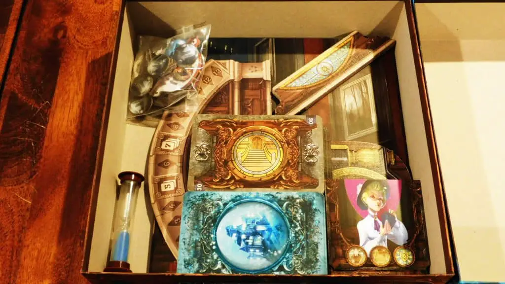 The Sleeves and other components being placed in Mysterium's box.